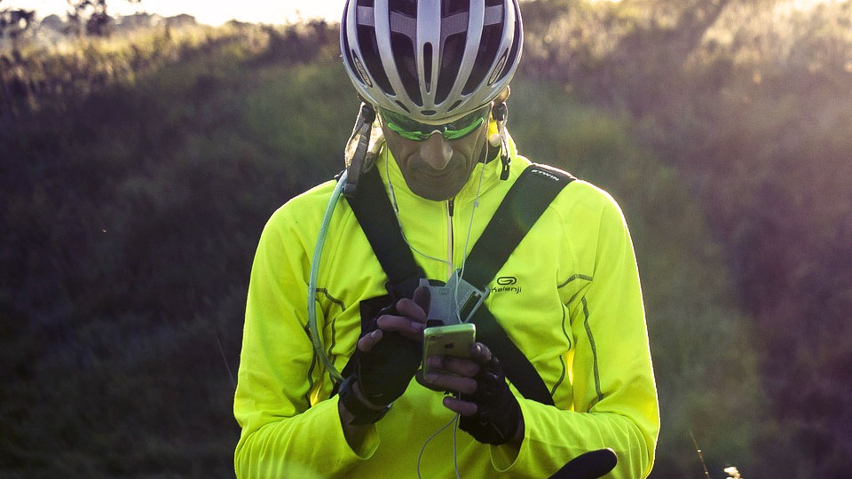 cyclist using his smartphone