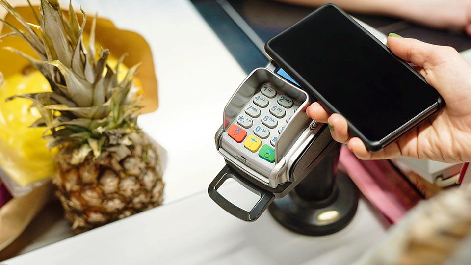 buying a pineapple and making a mobile payment