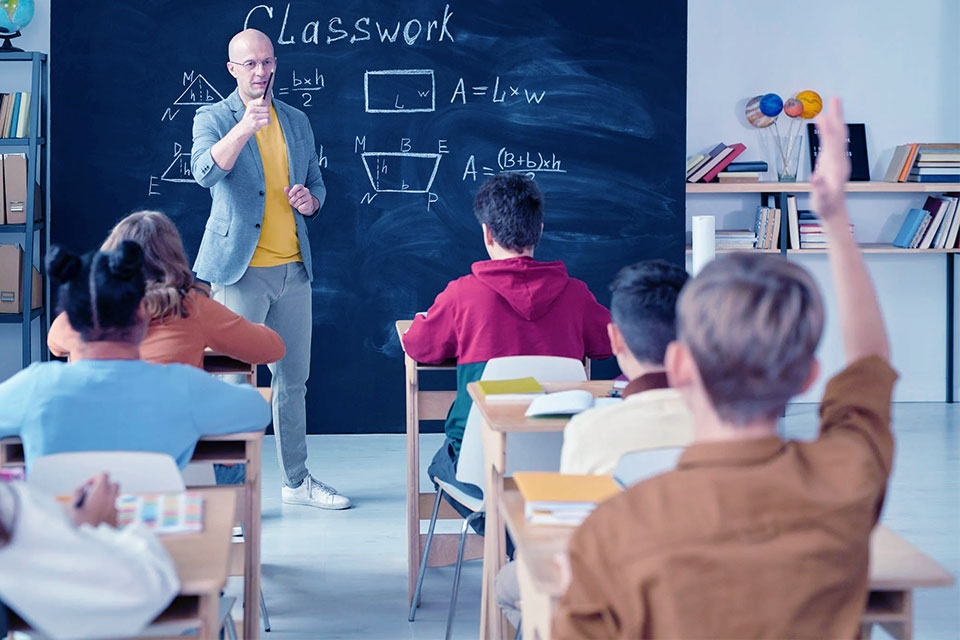 a teacher in the classroom with students