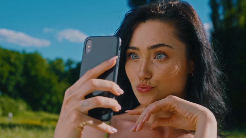 woman taking a selfie with her smartphone