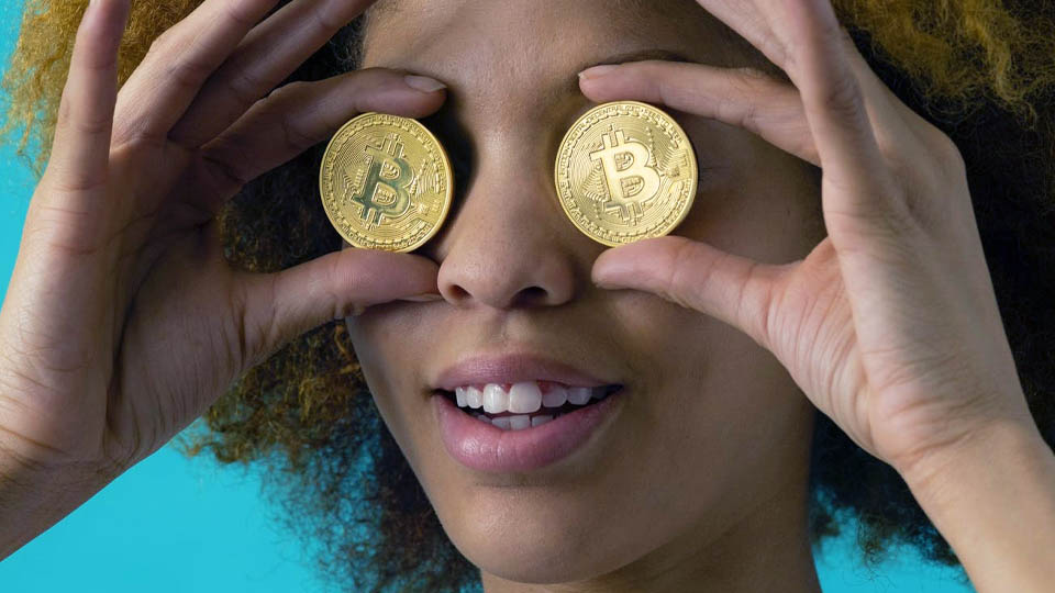 woman with bitcoins in her eyes