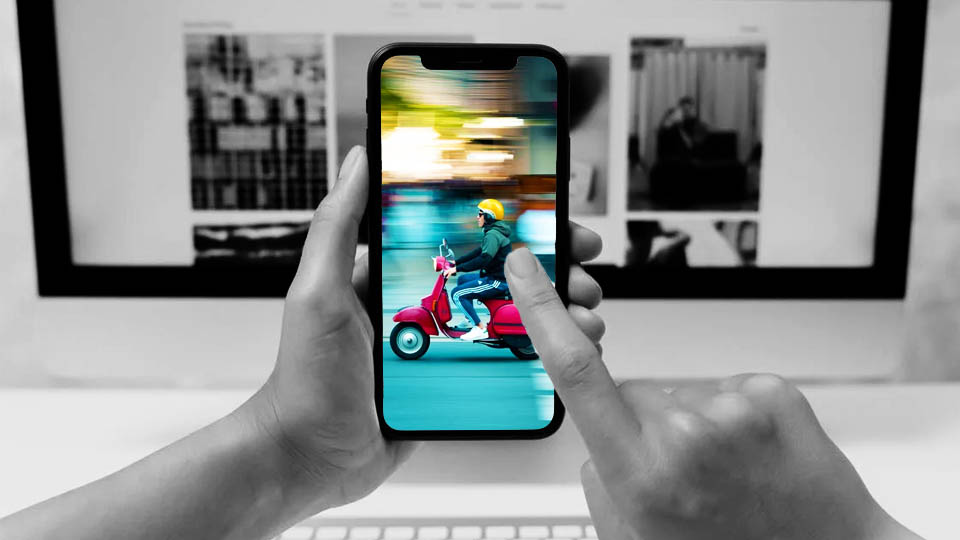 smartphone in hand showing a motorcycle