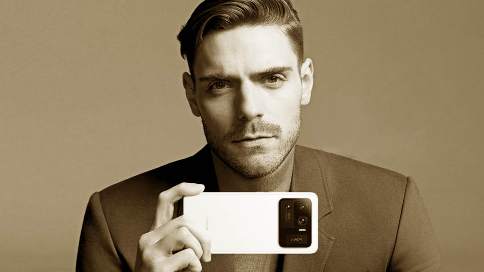 a man holding a smartphone showing the camera