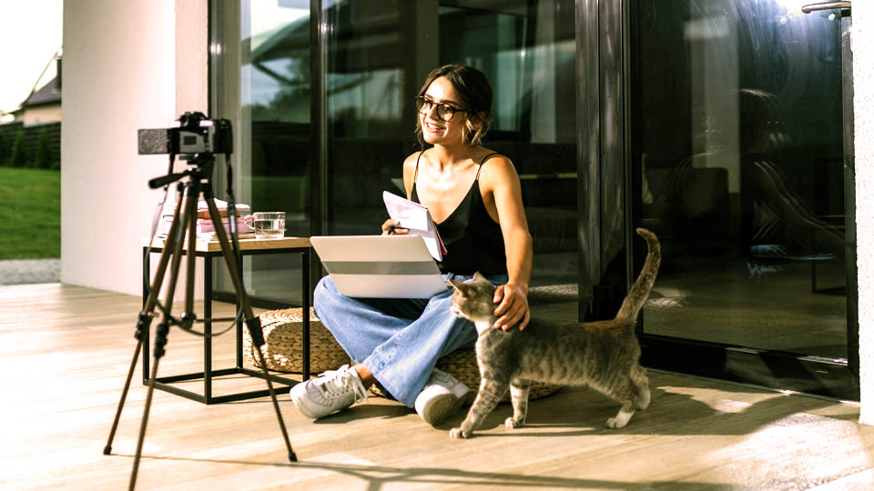 a woman recording a class at home