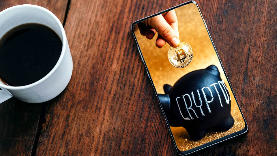 a smartphone on the table showing a cryptocurrency