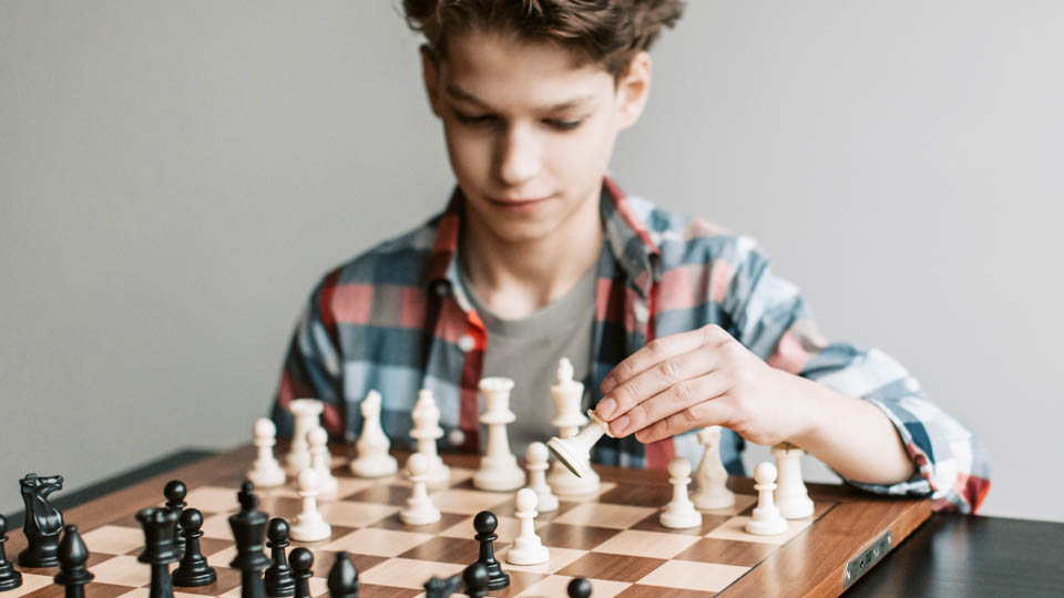a child playing chess