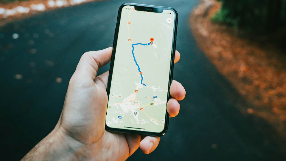 holding a smartphone with gps