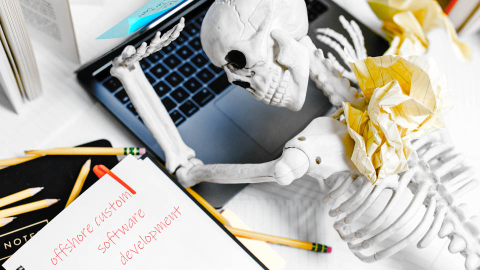 a skeleton developer on a laptop on the table