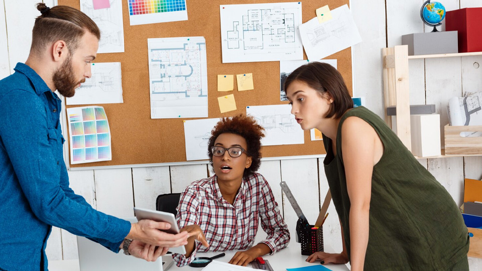 a team discussing and talking in the office